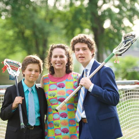 Jonna Gerken and sons with lacrosse sticks