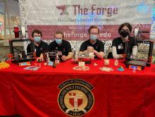 A table of people representing The Forge